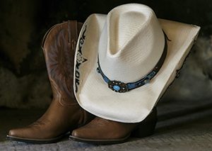 Cowboy boots and hat symbolizing the Western hoedown theme of the Advancing Opportunities fundraiser for people with disabilities in New Jersey