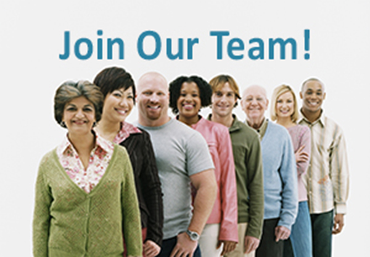 We're Hiring! Studio Shot of a Mixed Age, Multiethnic Group of Men and Women Standing in a Line