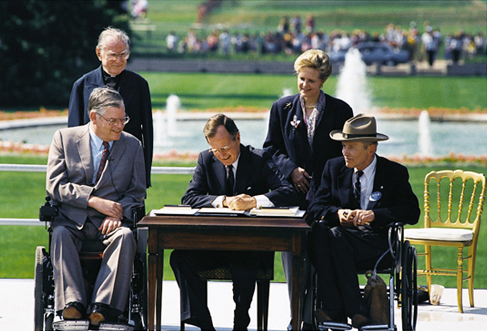 President Bush signs ADA into law for rights of people with disabilities