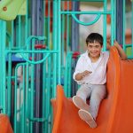 Boy with a disability in a park, inclusion