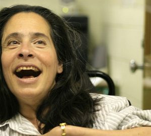 A woman uses eye-gaze assistive technology to succeed, featured disability articles