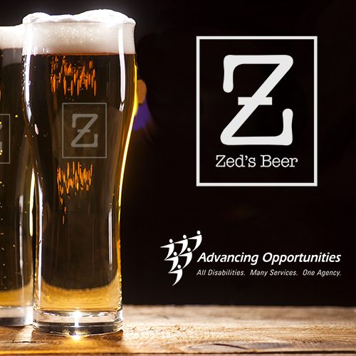 Two glasses of tasty Zed's Beer craft brew on wooden table and bar lights background.
